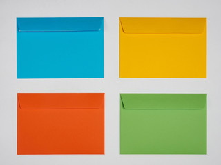 Blue, yellow, orange, green envelope on a white background