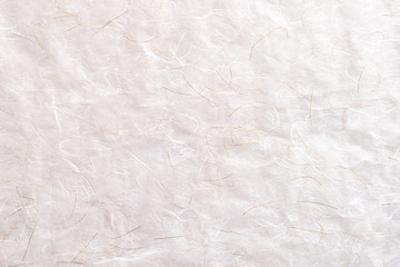 Pastel craft grey white mulberry flower rough paper textured abstract background. Recycled plain clean eco friendly kraft hand made gray paper natural material with gold thread for festive decoration.