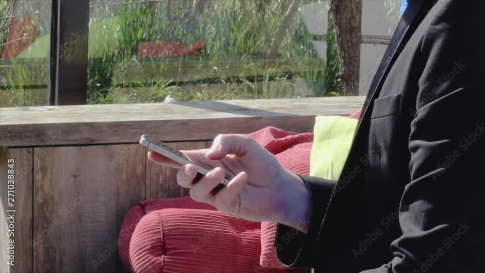 Poster close up professional businessman sending text message on smartphone.
