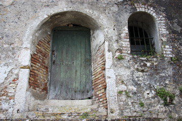 Fototapeta na wymiar Old Walls And Door Of Ancient Historic Building On Corfu Island Greece