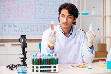 Young chemist working in the lab 