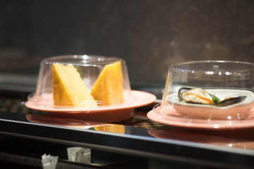 Japan food on conveyor buffet of sushi in restaurant