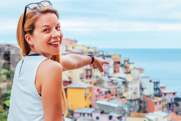 Fototapeta na wymiar Young woman traveling through Europe, Cinque Terre, Italy