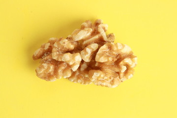 Peeled walnuts in colorful background