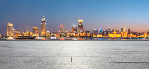 Shanghai bund city skyline and empty square floor at night,panoramic view