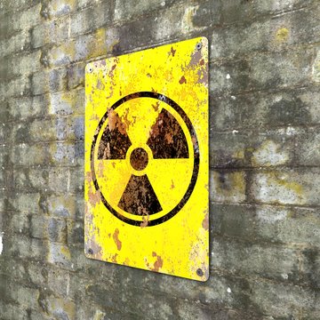 Nuclear site, sign hanging on a brick wall. Indication of the presence of a radioactive area, 3d render. Nuclear weapons. Dangerous site