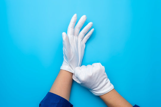 wearing white gloves