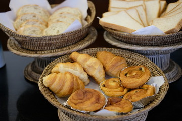 Close up bread and pastry in the bamboo basket