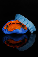 excellent impression of silicone and detail model on a black background with a vertical composition