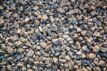 Nature background from gray sea pebbles. Sandy and rocky texture. Rocky wallpaper.