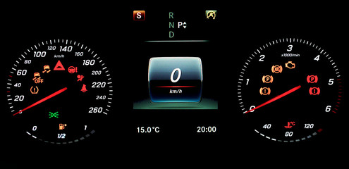A car instrument panel with speedometer, tachometer, odometer, fuel gauge, car's temperature gauge,...