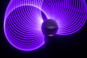 Microphone karaoke, concert . Vocal audio mic in low light with blurred background. Live music,...