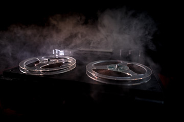 Special agent intelligence officer listens to conversations and records on a reel to reel tape recorder 3