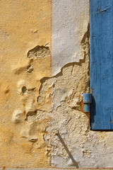 Weathered wall with old yellow paint