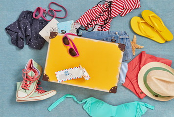 Summer vacation suitcase packing