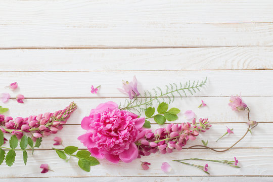 pink beautiful flowers on white wooden background - Powered by Adobe
