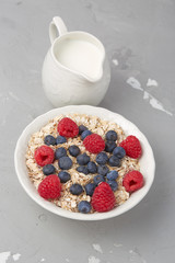 Breakfast Set: oat flakes, raspberries, blueberries and milk