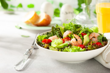 Fresh summer salad with shrimp, avocado and tomato