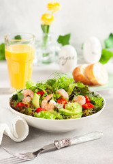 Fresh summer salad with shrimp, avocado and tomato
