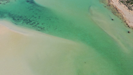 Fototapeta na wymiar Aerial drone bird's eye view photo of tropical caribbean paradise bay and lagoon with white sandy beach and turquoise clear sea
