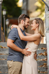 Young and beautiful couple embracing and smiling after kiss