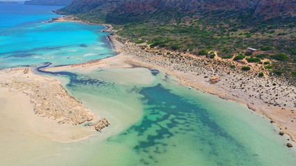 Aerial drone bird's eye view photo of tropical caribbean paradise bay and lagoon with white sandy beach and turquoise clear sea