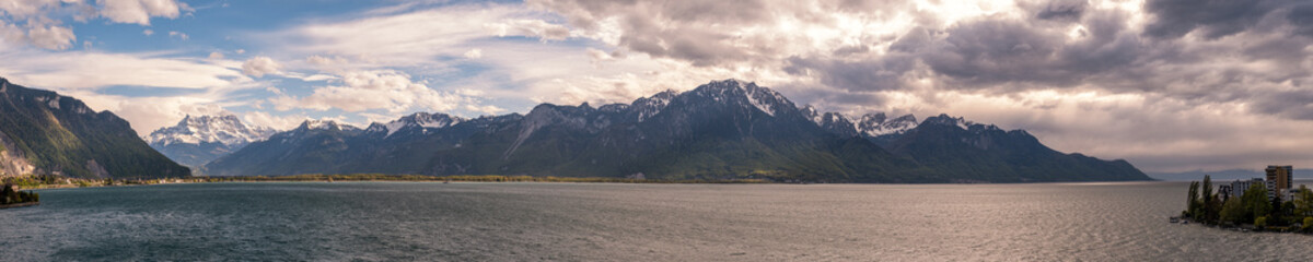 Panoramic view of Lake Geneva and snow capped mountains