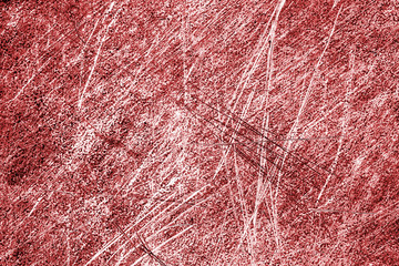 Red color grunge scratched metal texture.