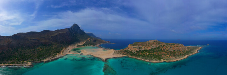 Aerial drone panoramic view of iconic azure turquoise Balos beach lagoon near Gramvousa island and pure white sand, North West Crete island, Greece