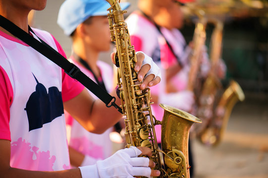 musician playing the saxophone in the Marching Band Beautiful voice / Jazz mood Concept