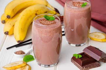 Chocolate banana milkshake (smoothie). Summer cold drink.