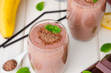 Chocolate banana milkshake (smoothie). Summer cold drink.