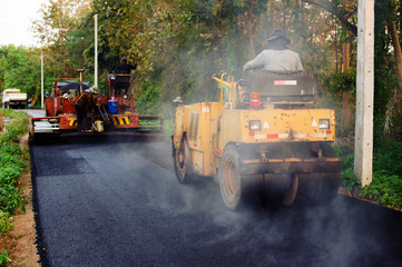 Heavy Vibration roller compactor at asphalt pavement works for road repairing