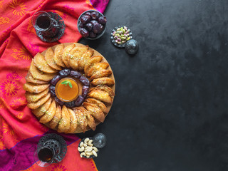 Arabic sweets. Arabian Qatayef. Cookies of El Fitr Islamic Feast. Ramadan food background. 