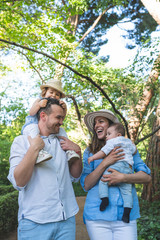 Fototapeta premium Happy Hispanic Family Having Fun Together Outdoors.