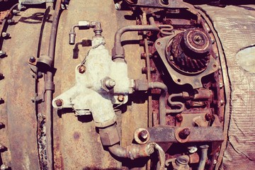 Steampunk vintage jet engine. Unusual old aircraft technology. Engine parts of a jet plane. Vintage engine with tubes and hoses.