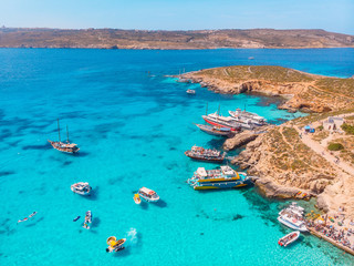 Panorama of Blue Lagoon Comino Malta. Cote Azur, turquoise clear water with white sand. Aerial view - obrazy, fototapety, plakaty