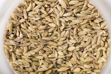Closeup of dry fennel seeds in a jar