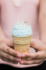 waffle Cup mint ice cream with chocolate chips in hand isolated