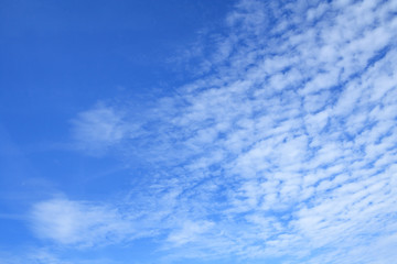 White clouds in azure sky as background
