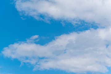 Obraz premium Blue sky with fluffy clouds. Natural landscape. Spring nature scene.