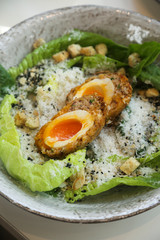 Caesar salad with Scottish egg