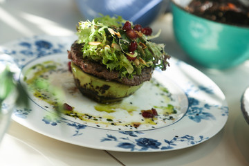 Healthy avo burger with beef and salad