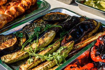Grilled eggplants and marrows in a metal tray