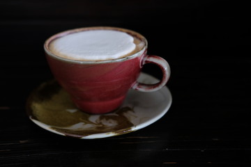 Cappuccino coffee cup on wood table