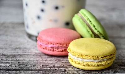 colorful macaroons on wooden table