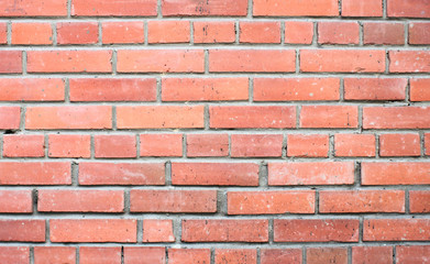 Old brick wall, old texture of red stone blocks closeup