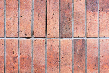 Old brick wall, old texture of red stone blocks closeup