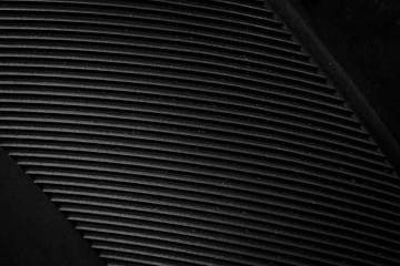 black paper texture or background with spotlight, dark tone 
