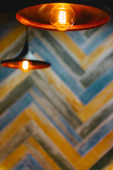 Close up many yellow lamp in cafe at night for background